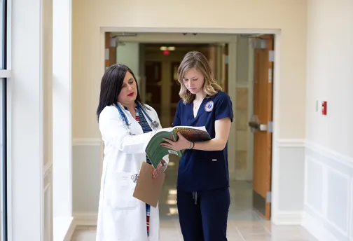Two medical professionals in conversation.