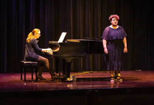 A choir student performs during the senior recital
