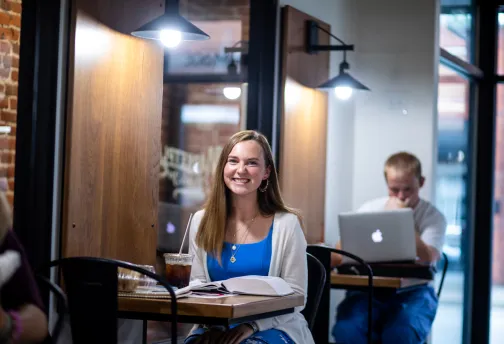 A student studies inside Cumberlands coffee shop. 