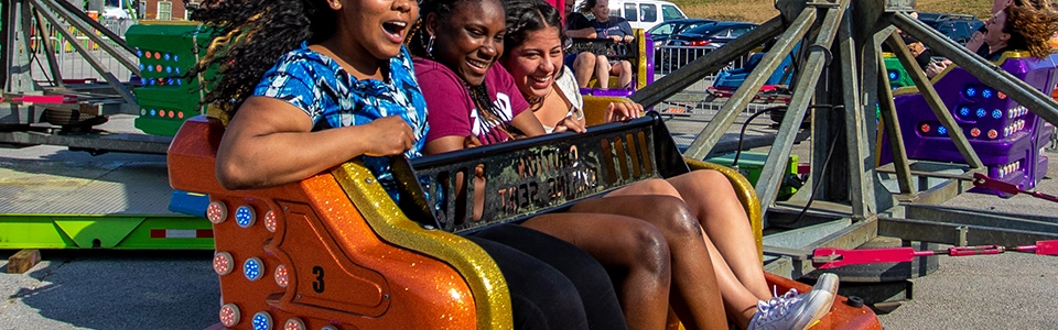 Students ride a carnival ride during a recent campus event. 