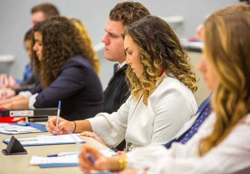 Students taking notes