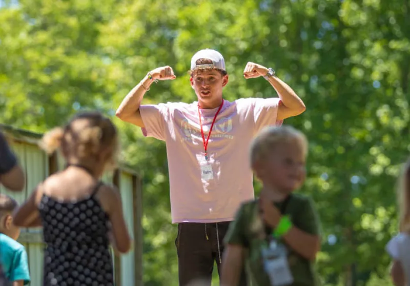 guy leading kids' recreation activities