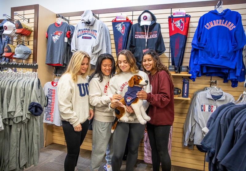 Students show off gear in the campus bookstore
