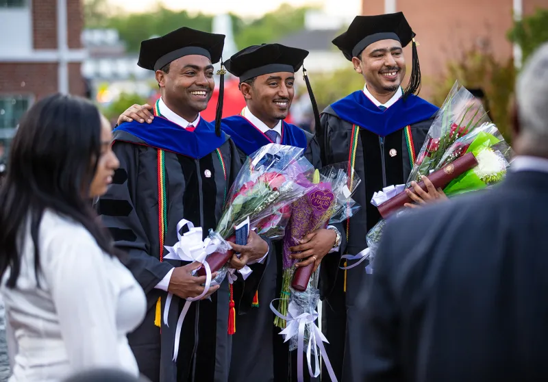 Executive graduate students celebrate following Commencement