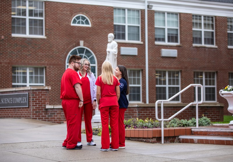 Nursing students having a conversation on campus