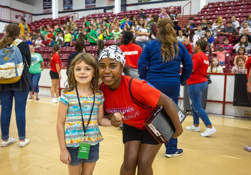 Students help local school children during Shoes 4 the Soul