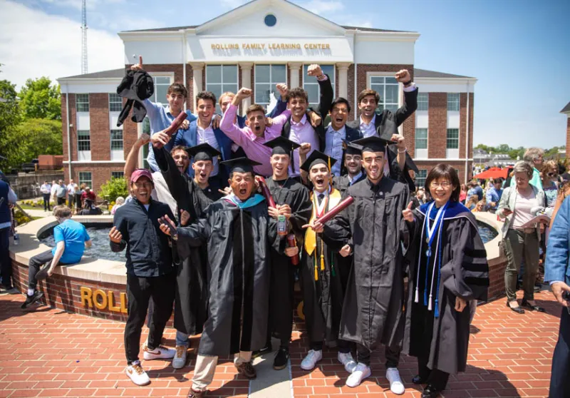 Group of graduates cheering