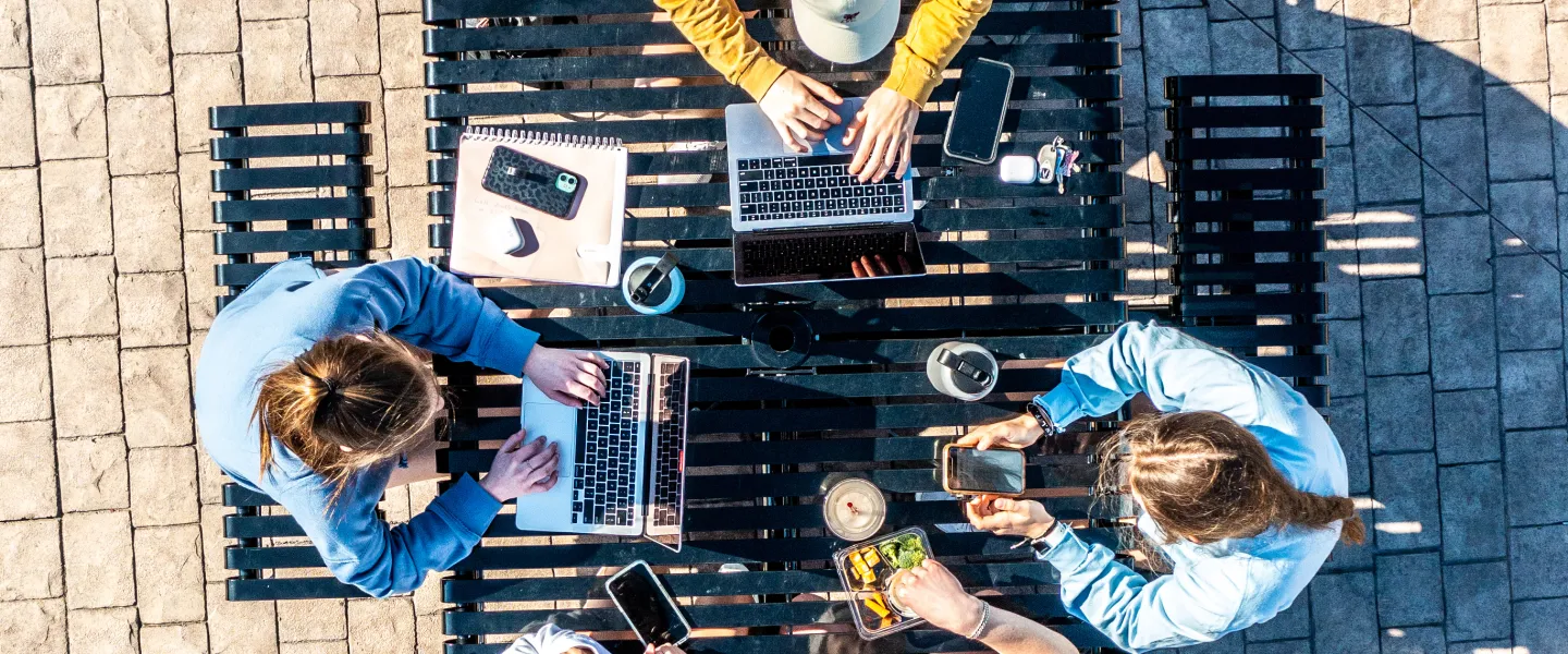 An aerial footage of several students studying outside