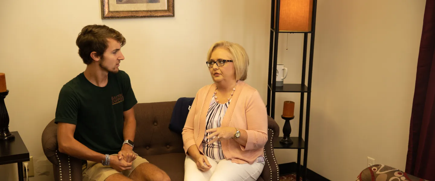 Student speaking with a counselor