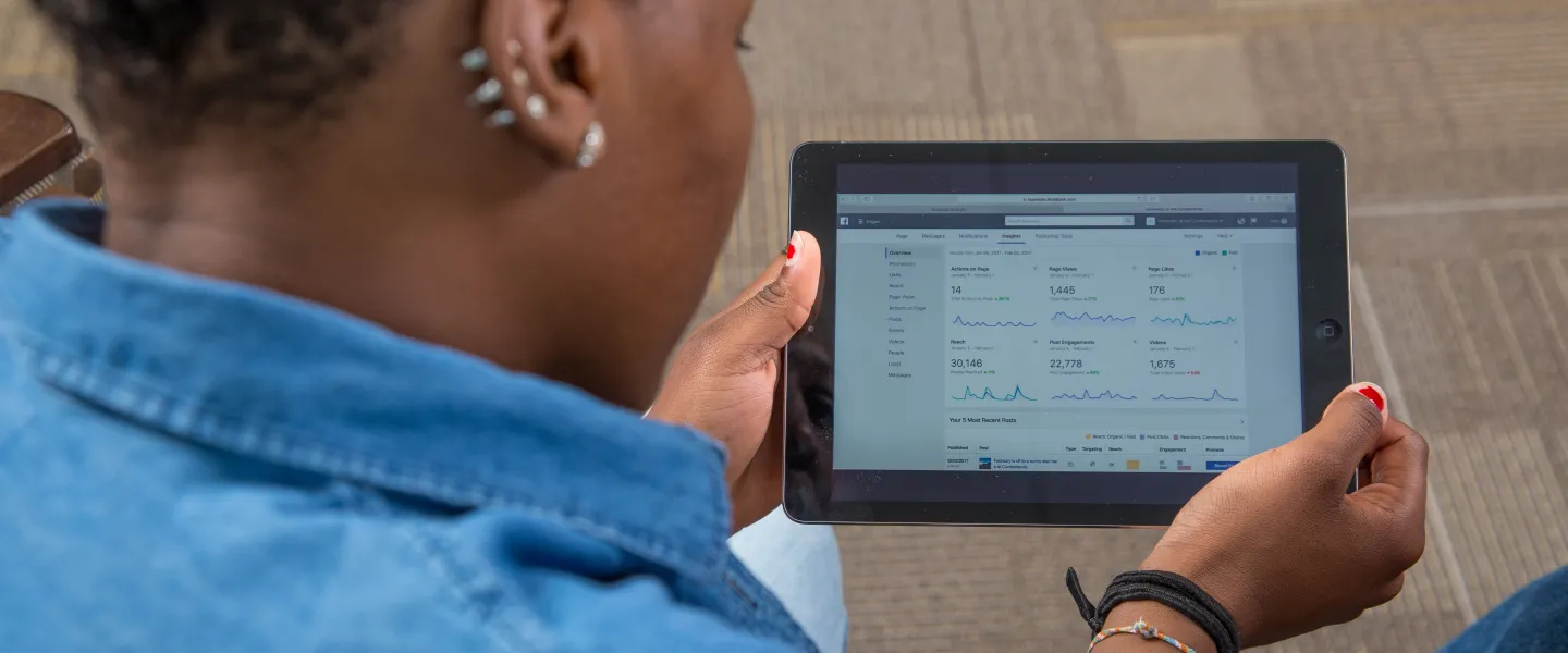 A woman looking at a tablet