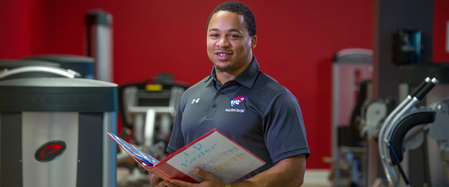 A personal trainer in a gym