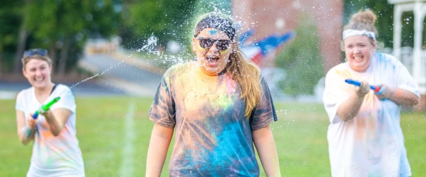 Students playing with super soakers
