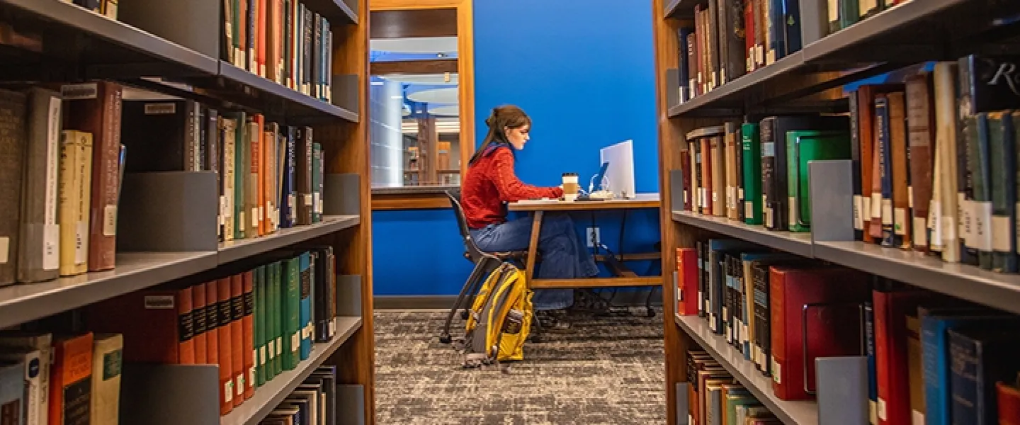 Student studying in a library