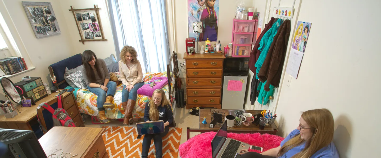 Students sitting in a dorm room