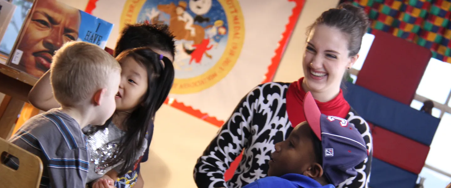 A teacher with children in a classroom