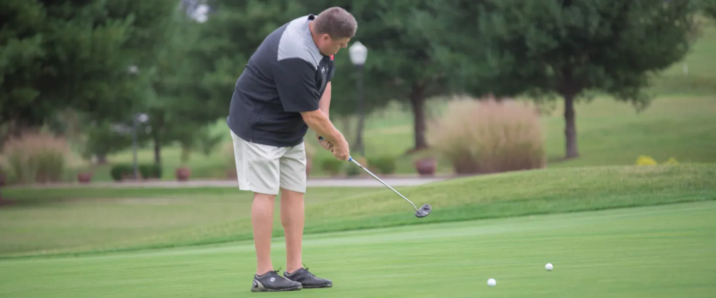 A golfer putting