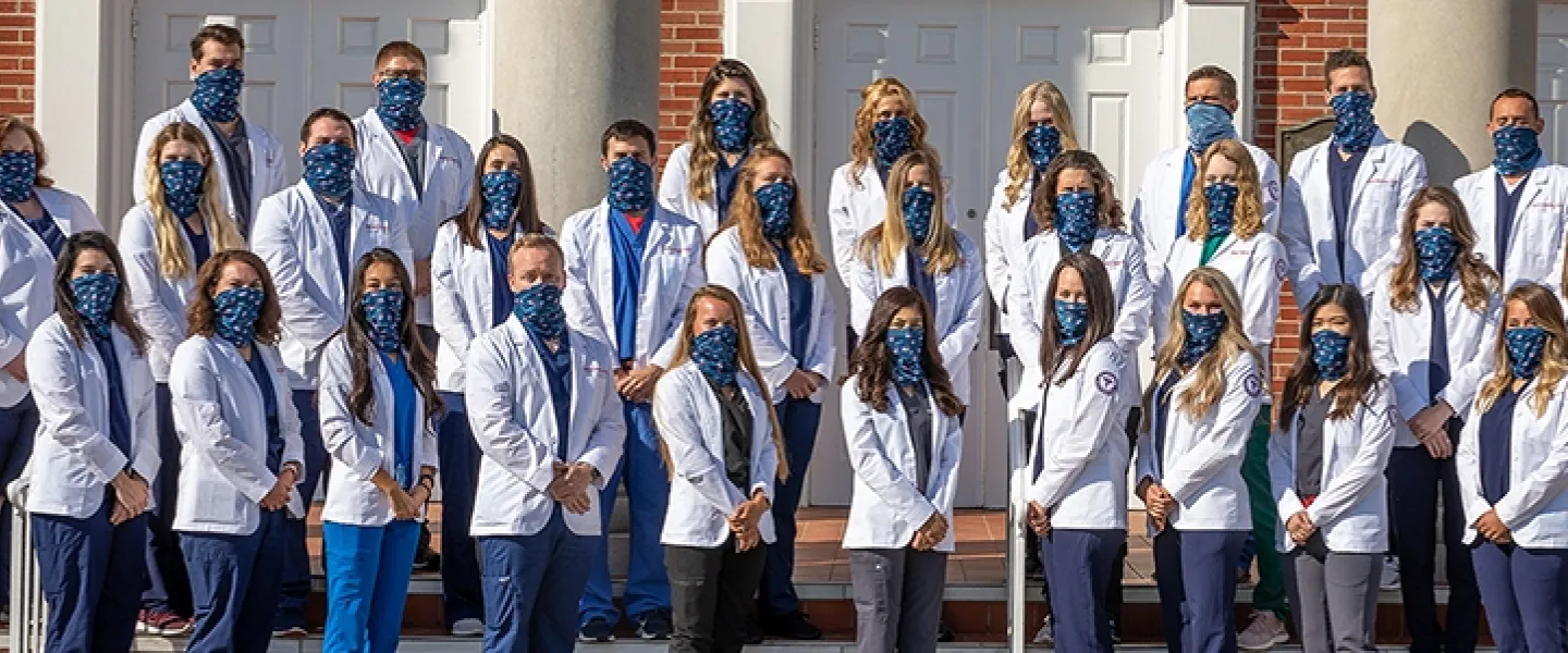 Students wearing physician coats