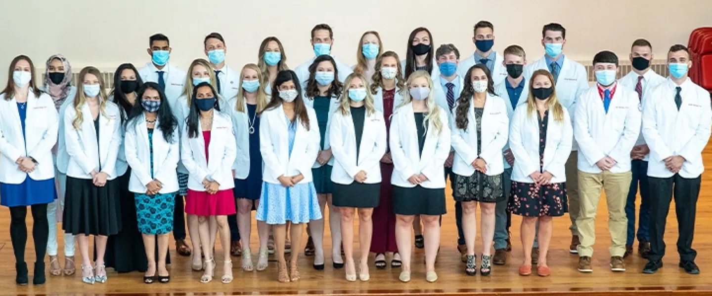 Students wearing physician coats