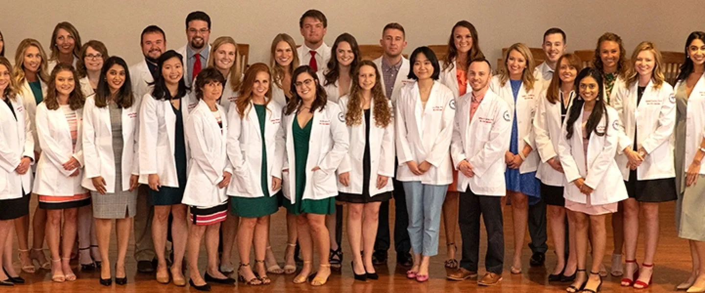 Students wearing physician coats