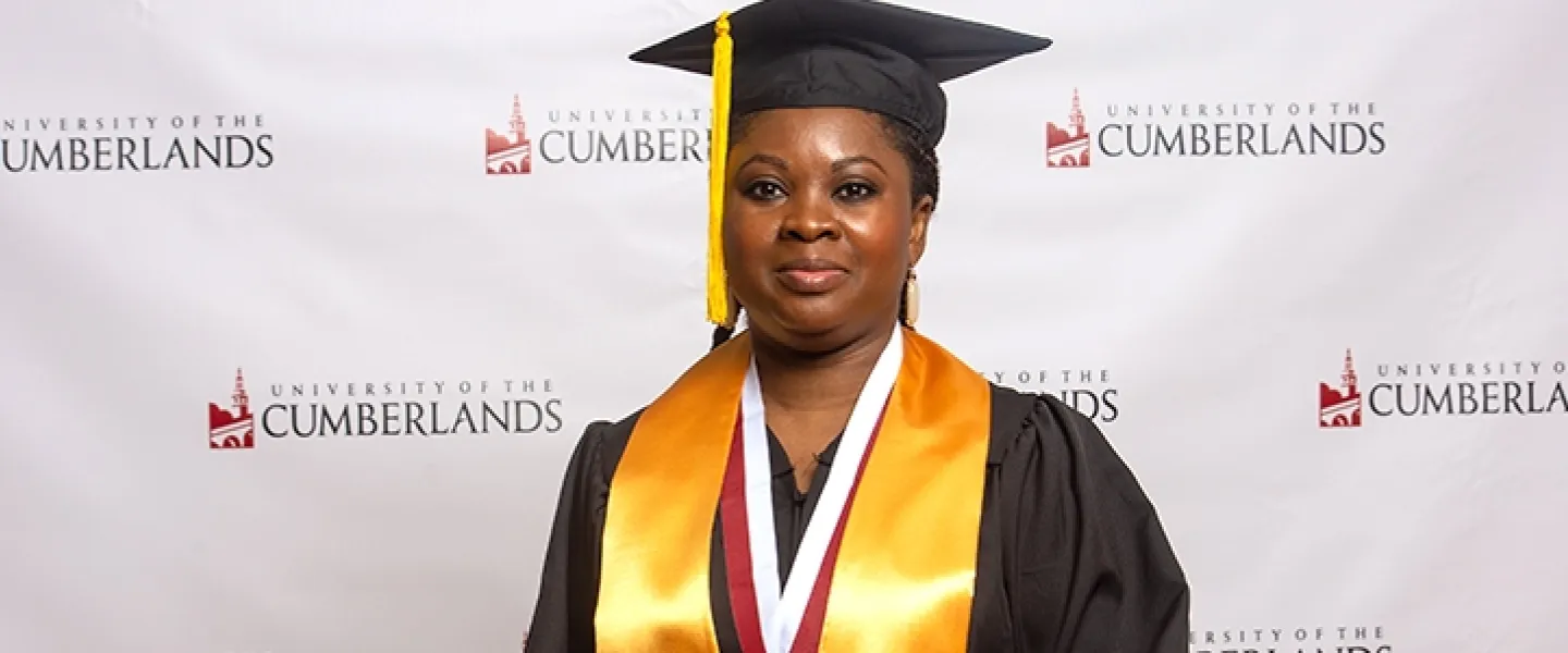 Image of a graduate in cap and gown