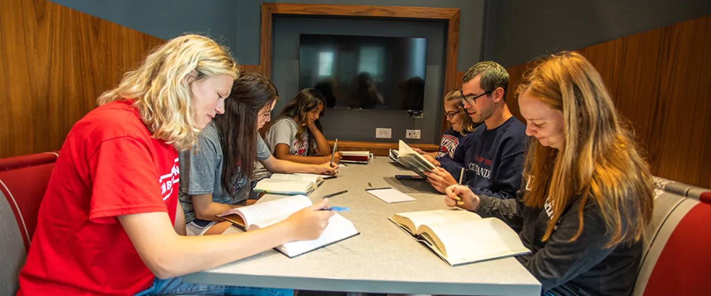 Students studying at a table