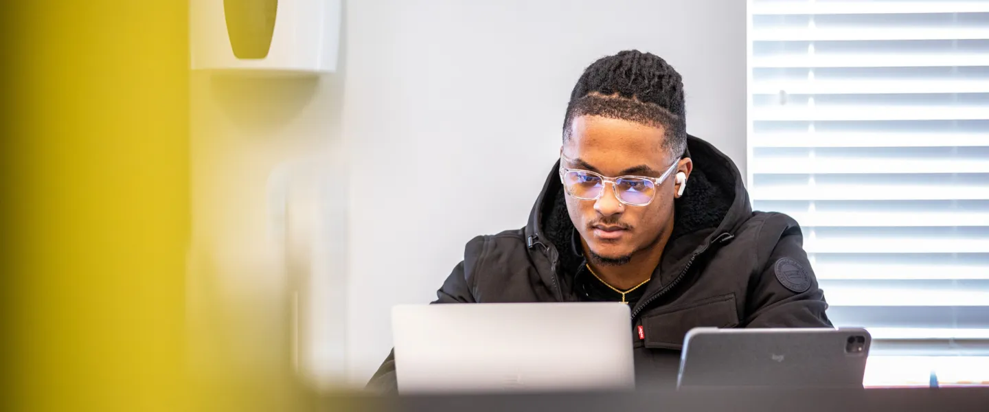 A student using a laptop