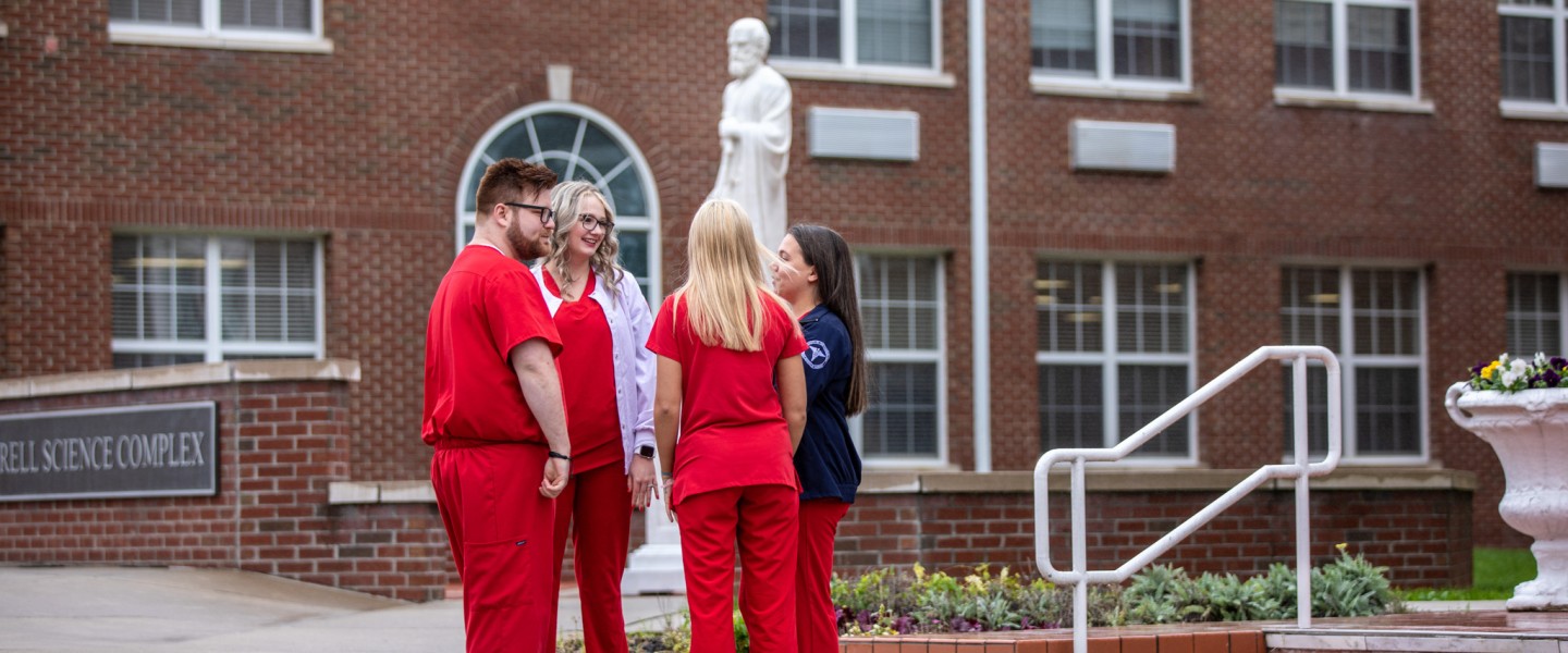 Nursing students having a conversation on campus