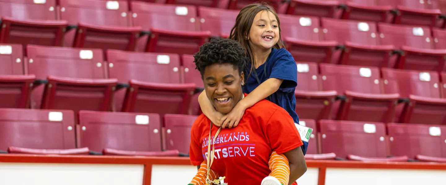 A Cumberlands student spends time with a local child during Shoes 4 the Soul
