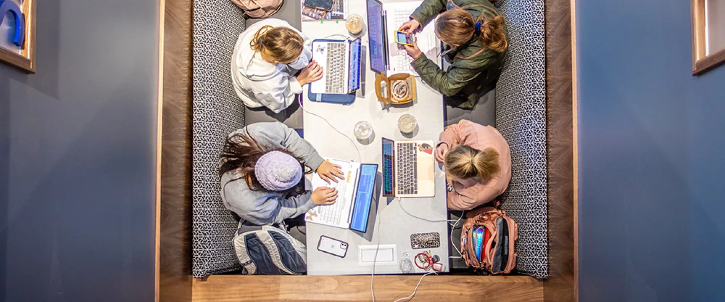 A group of students study in the library. 