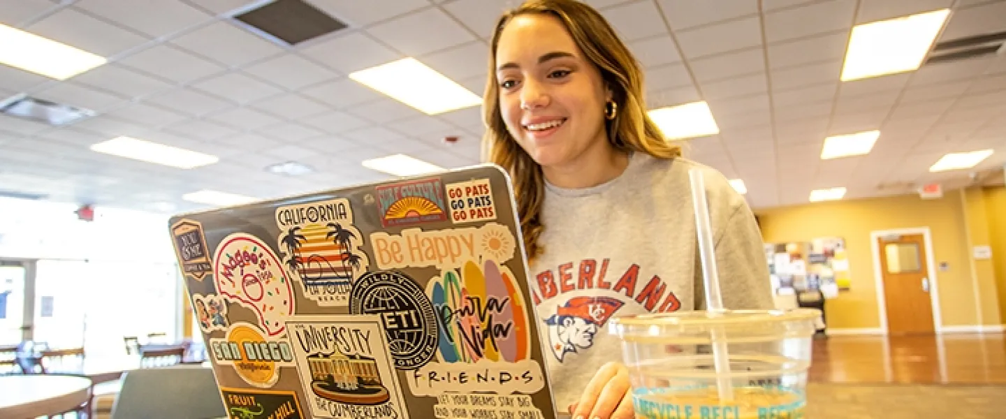 A student using a laptop