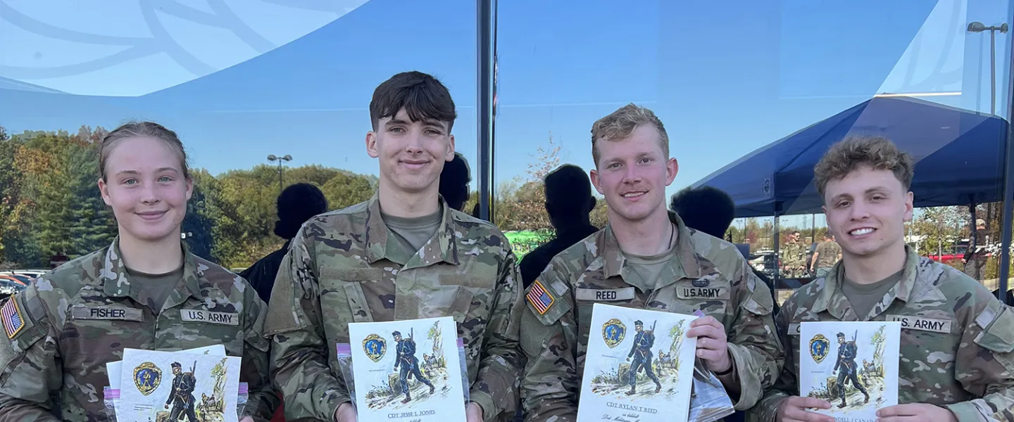 ROTC cadets celebrate completion of a Ruck March 