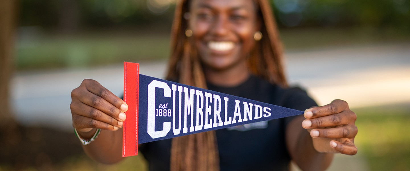 A Cumberlands student shows off the school's pennant 