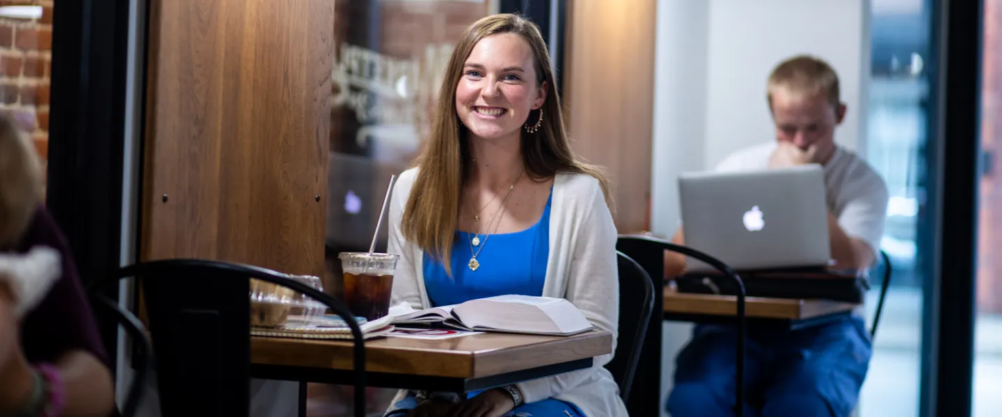 A student studies inside Cumberlands coffee shop. 