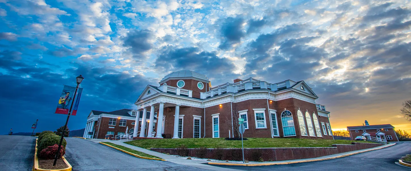 Sun rises over the campus science center. 