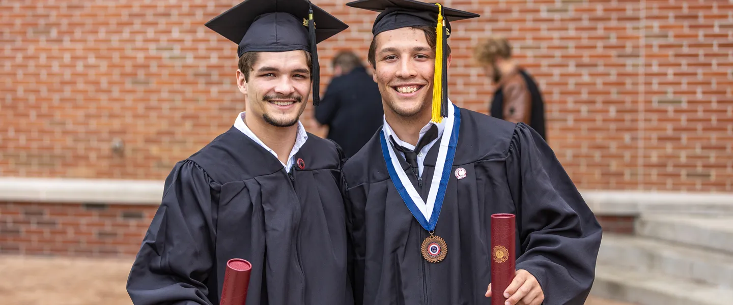 Students display their diplomas following Cumberlands graduation. 