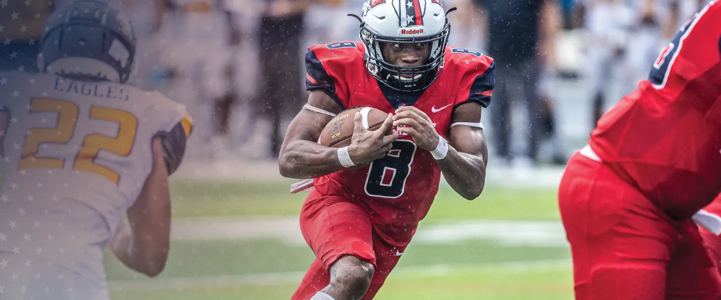 A Cumberlands running back follows his blockers on a play. 