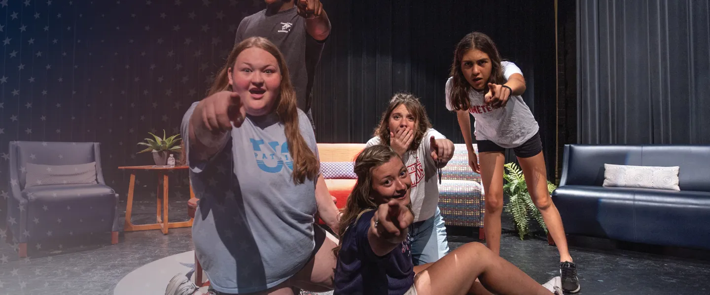 Students act out a scene in the university theatre. 