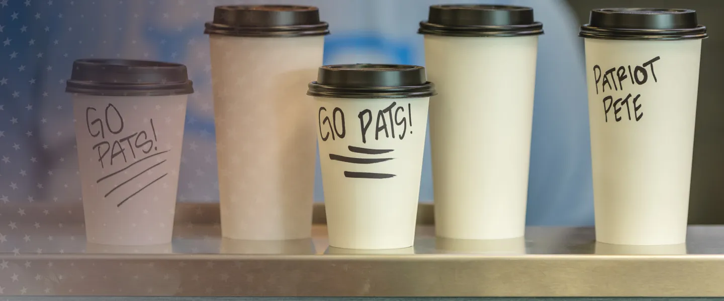 Several cups of coffee on display. 