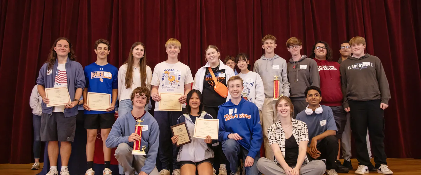 A group of students from the local community presented with a math award. 