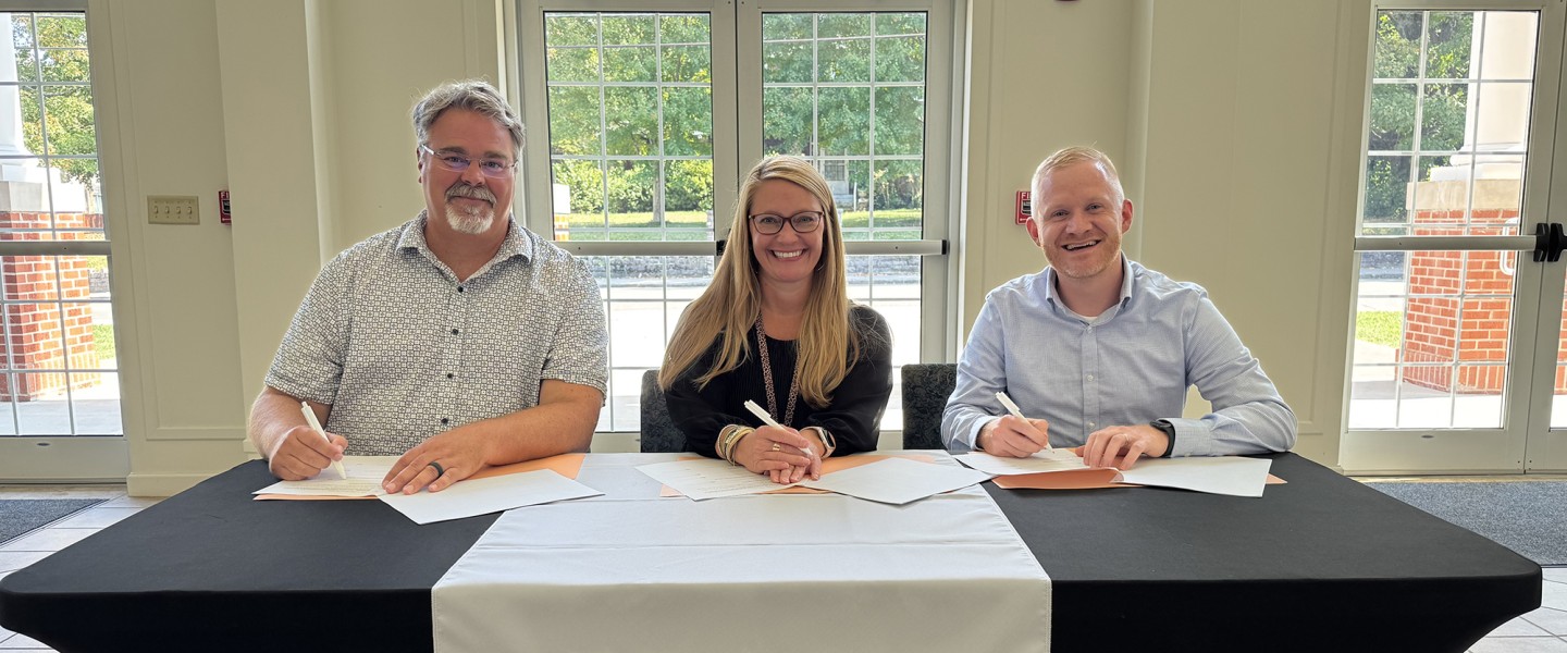 Officials from Main Street Baptist, Williamsburg Independent School, and University of the Cumberlands sign an agreement to operate an early childhood center. 