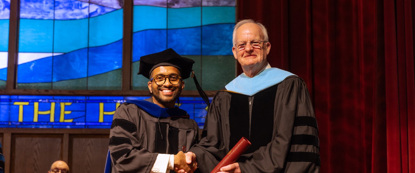 Dr. Sonal Sagar Boda receives his diploma from President Cockrum. 
