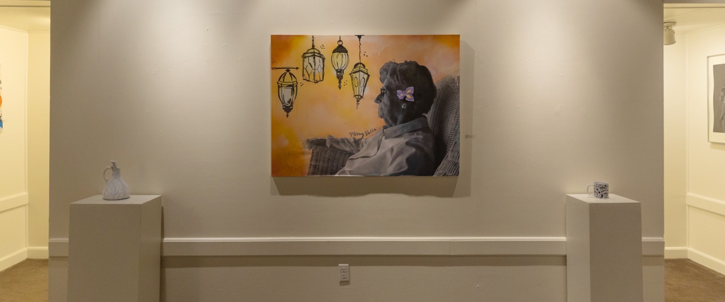 A student painting of an older woman inside the Cumberlands art gallery. 