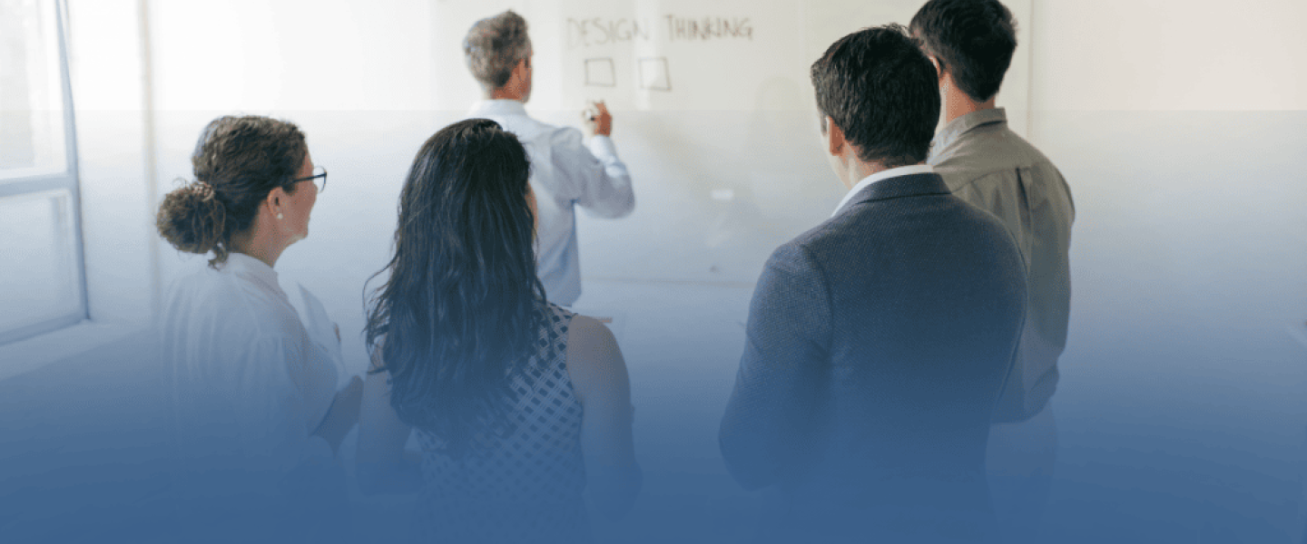 Business Professionals Taking Notes in Meeting