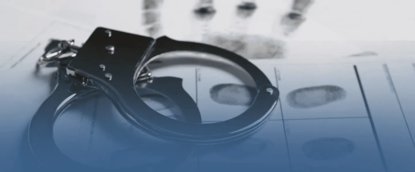 Handcuffs on Fingerprinted Paper