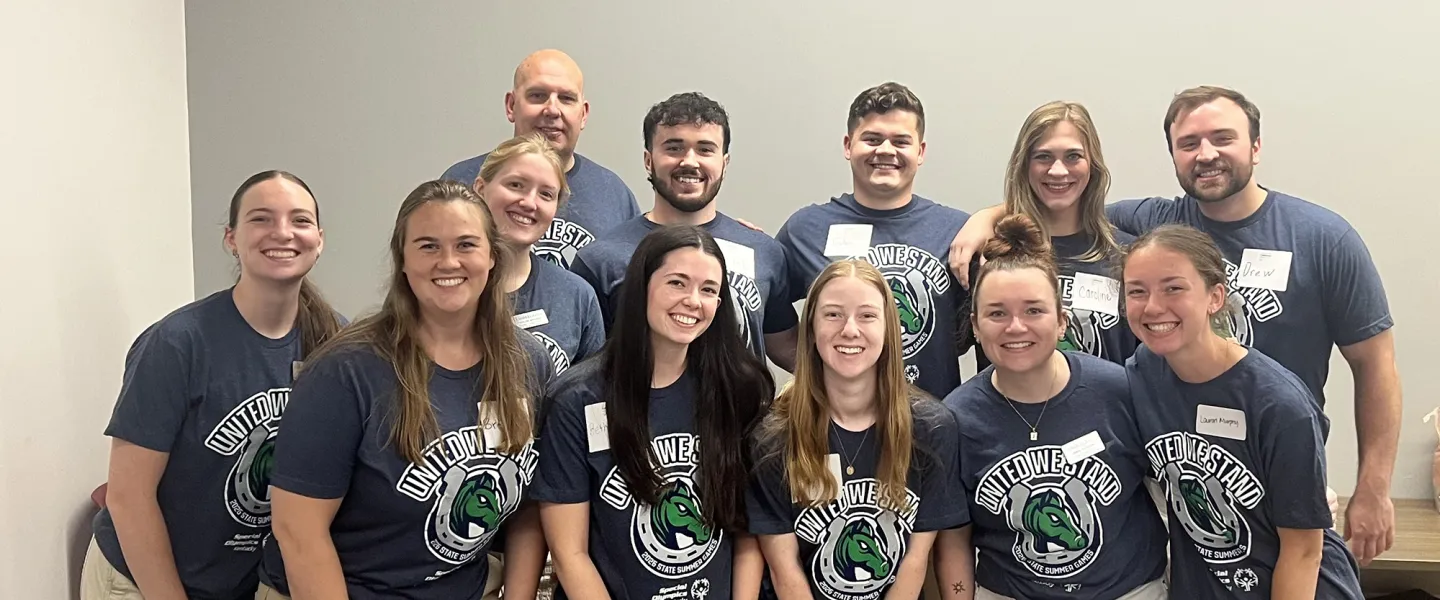 A group of physical therapy students pose together after a fitness event. 