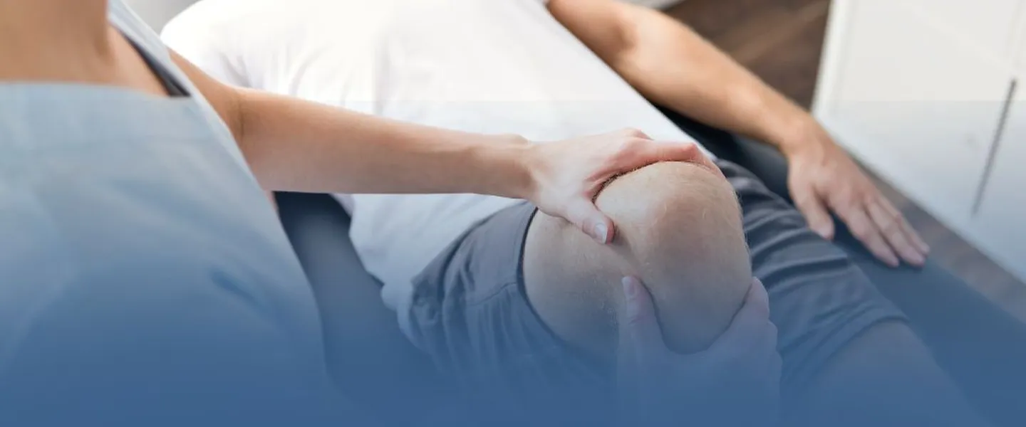 Physical Therapist Working on Patient Knee