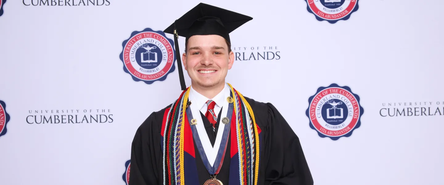 Trey Jackson posing for a graduation photo. 
