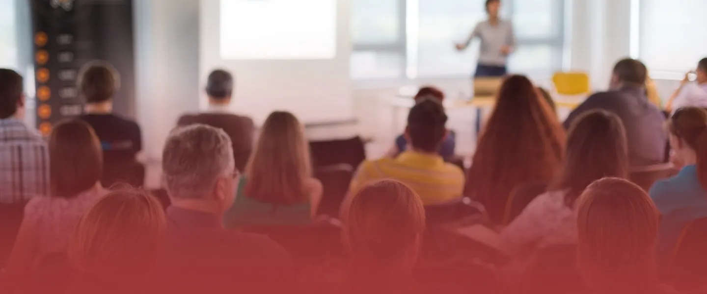 Educator at the Front of a Classroom Lecturing
