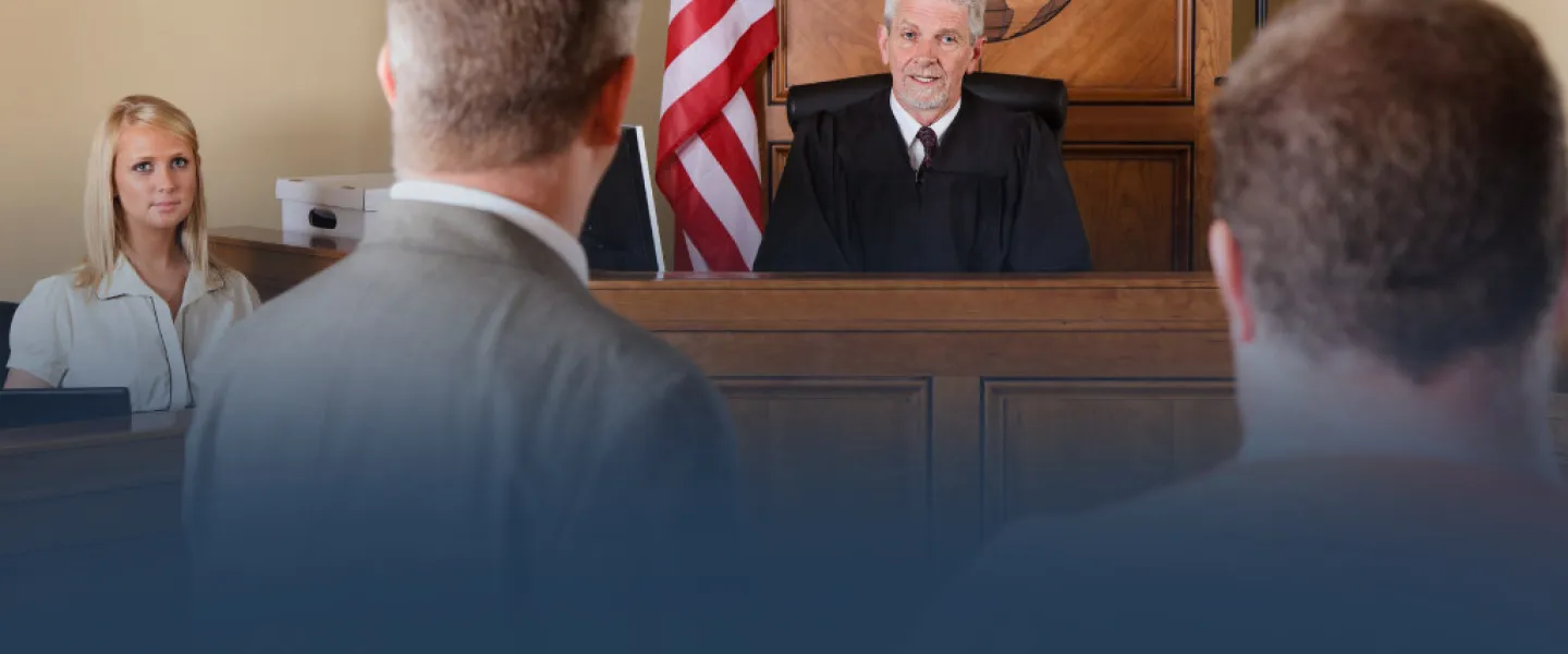 Judge with Lawyers in Courtroom