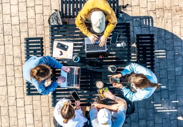 An aerial footage of several students studying outside